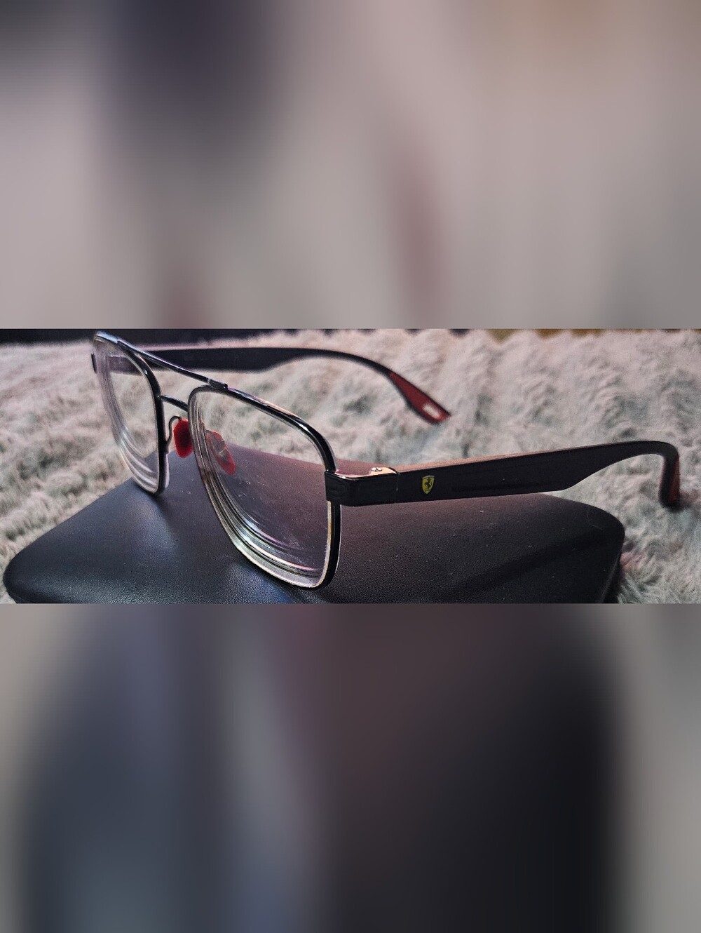 Ray-Ban Scuderia Ferrari collection eyeglasses with a matte black frame.read